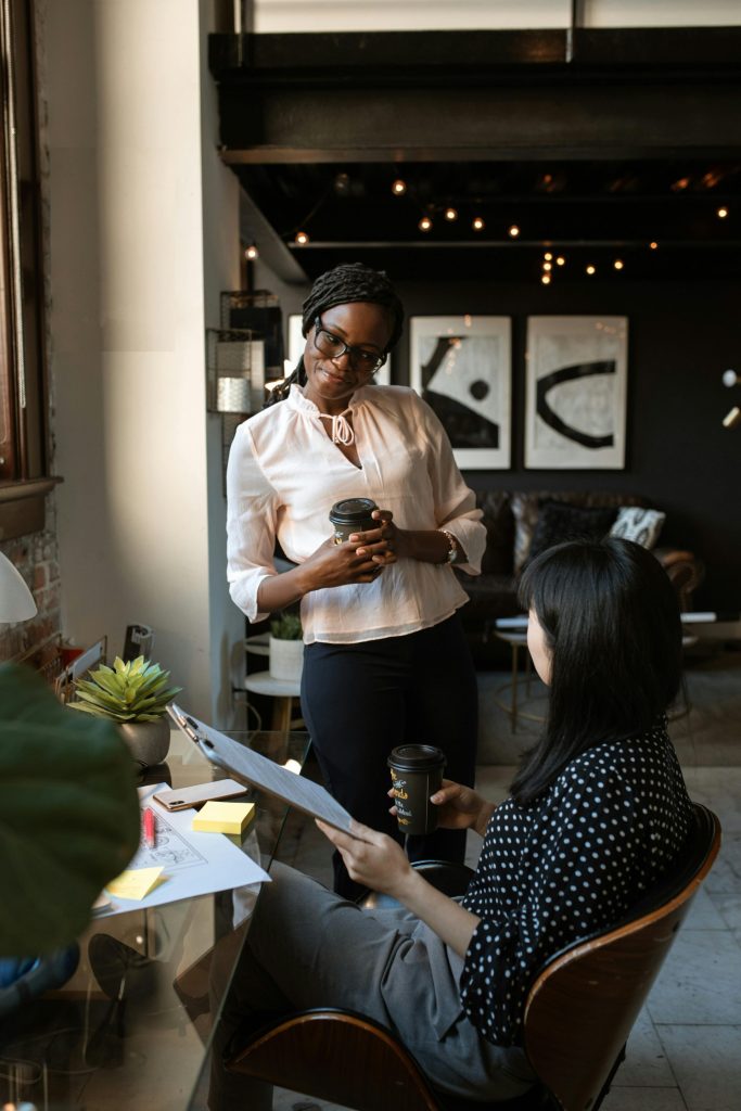 Two women discussing in café